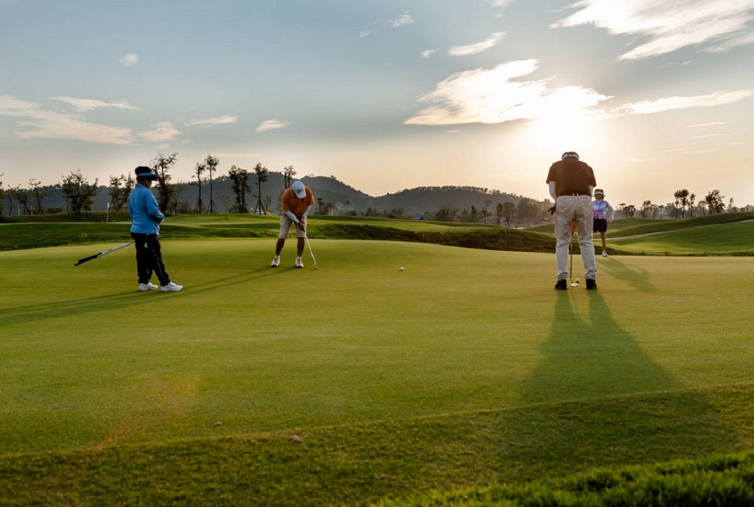A photo of 3 golfers playing golf at Alpine Golf Resort Chiang Mai