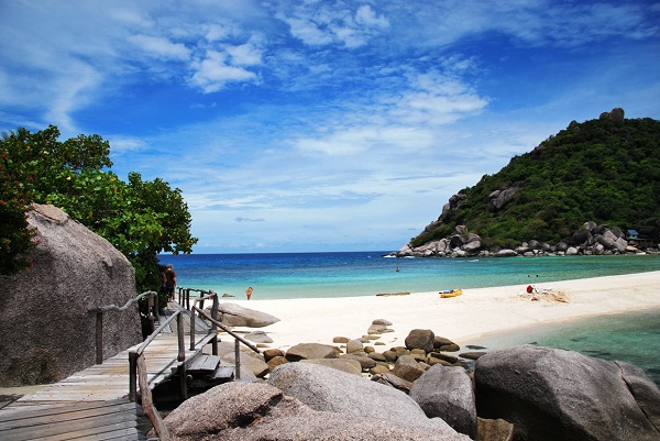 Wooden walking bridge to white sand beach at Koh Nang Yuan